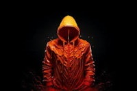 a man in an orange hoodie on a black background